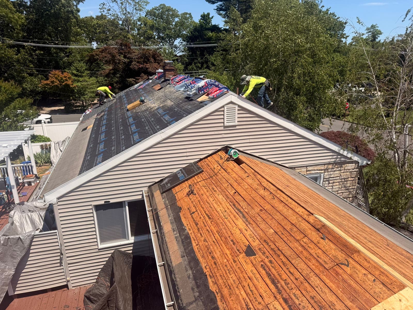 Old shingles vs exposed decking contrast — Green Apple Roofing, New Jersey