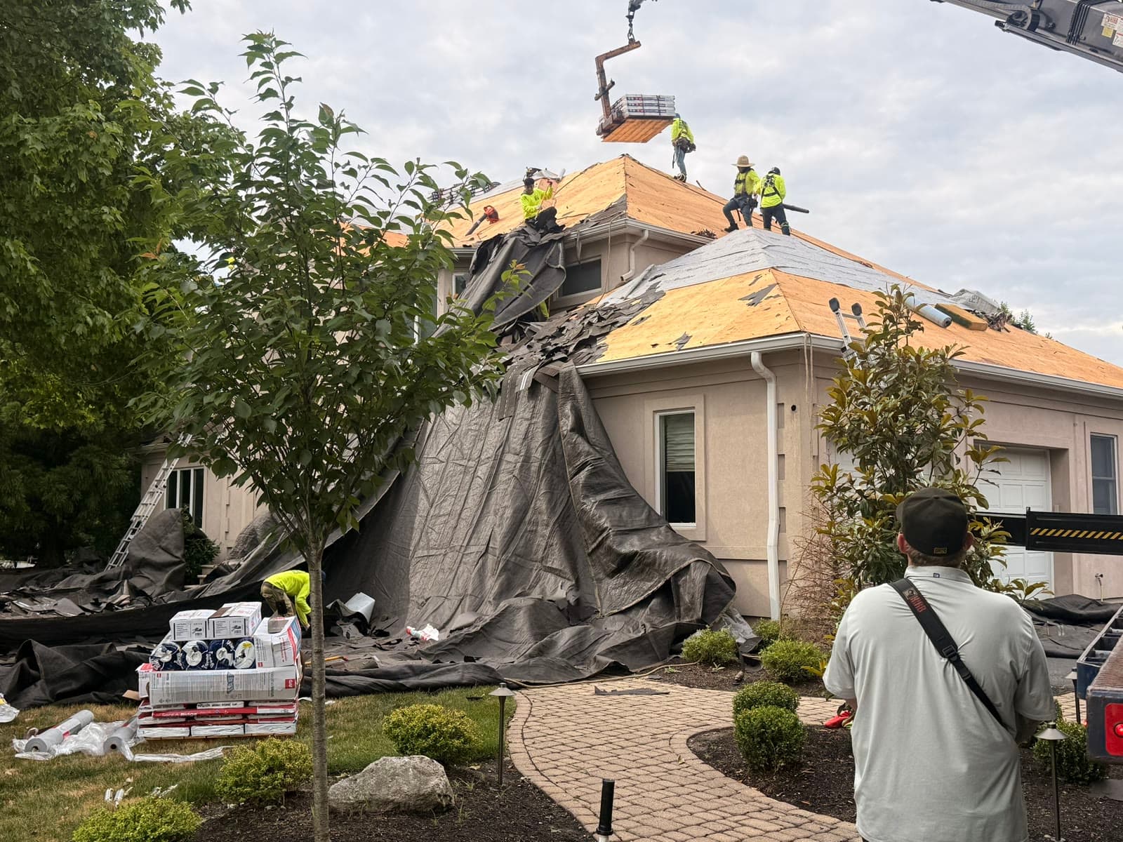 Crew on large roof with crane, tarped — Green Apple Roofing, New Jersey