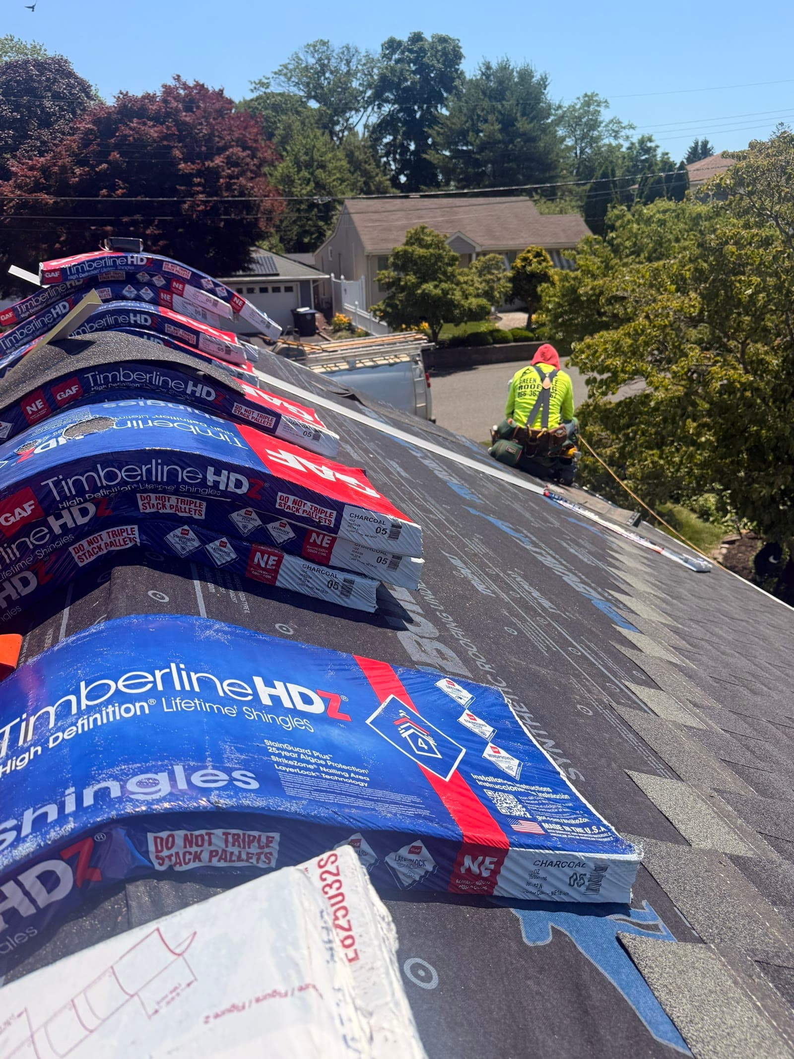 Stacked GAF Timberline HD bundles on roof — Green Apple Roofing, New Jersey