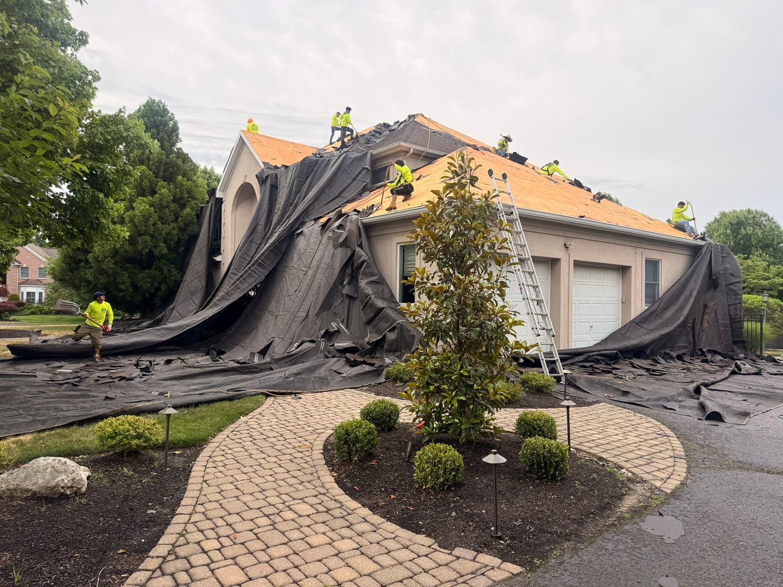 Large home mid-reroof, landscaping tarped — Green Apple Roofing, New Jersey