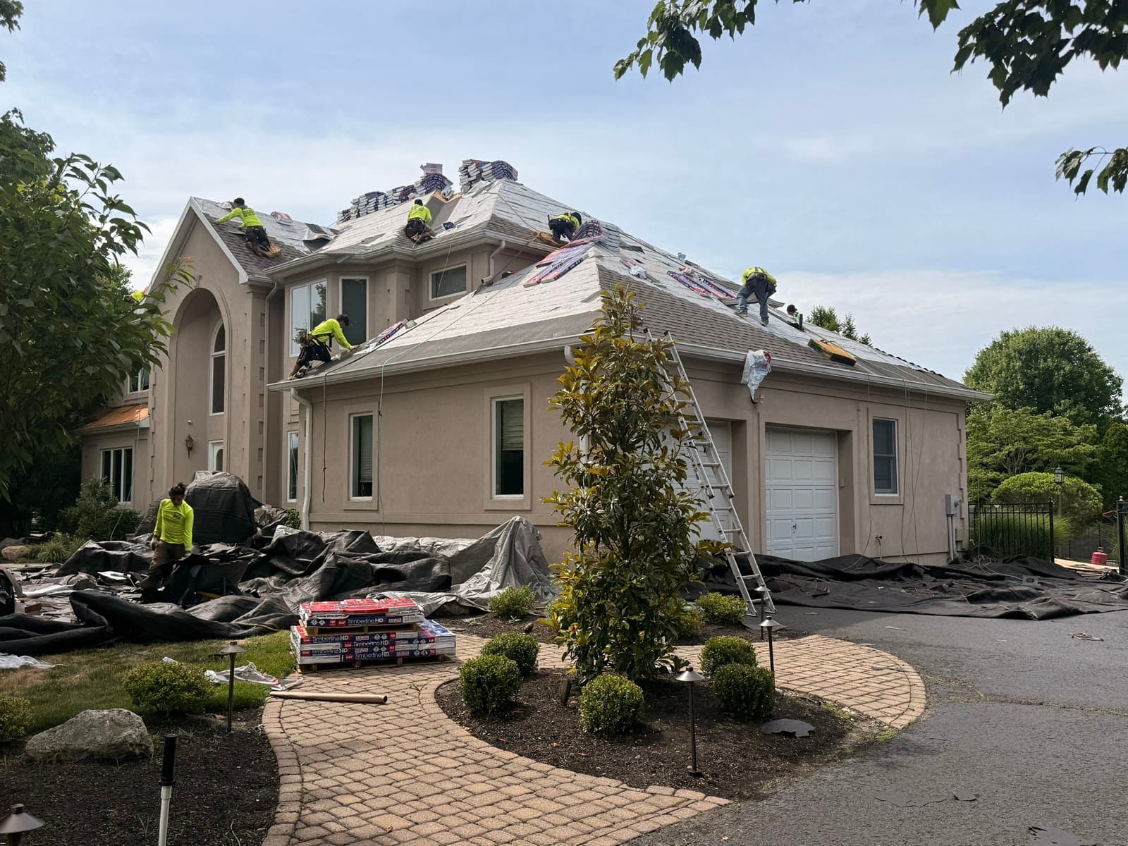 Multiple crew on large stucco home, deck — Green Apple Roofing, New Jersey