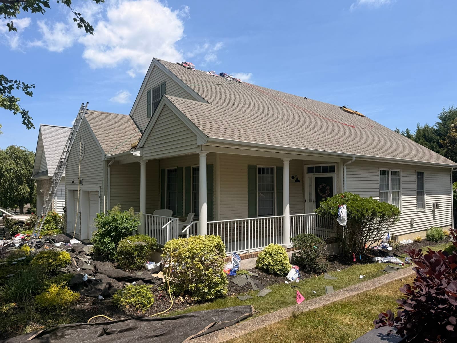 Completed home with new roof under blue sky — Green Apple Roofing, New Jersey