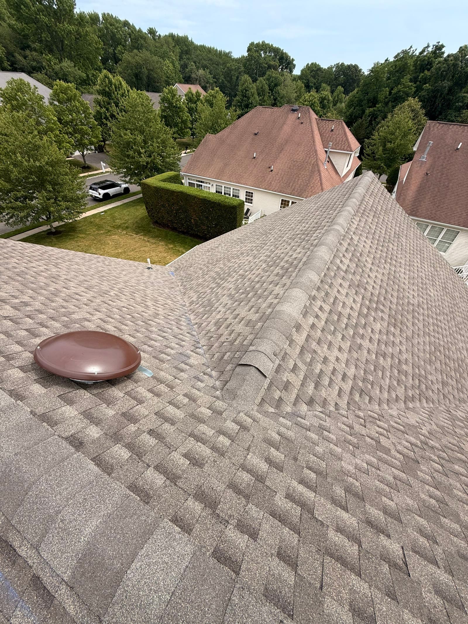 Elevated view of a finished shingle roof over the neighborhood — Green Apple Roofing, New Jersey