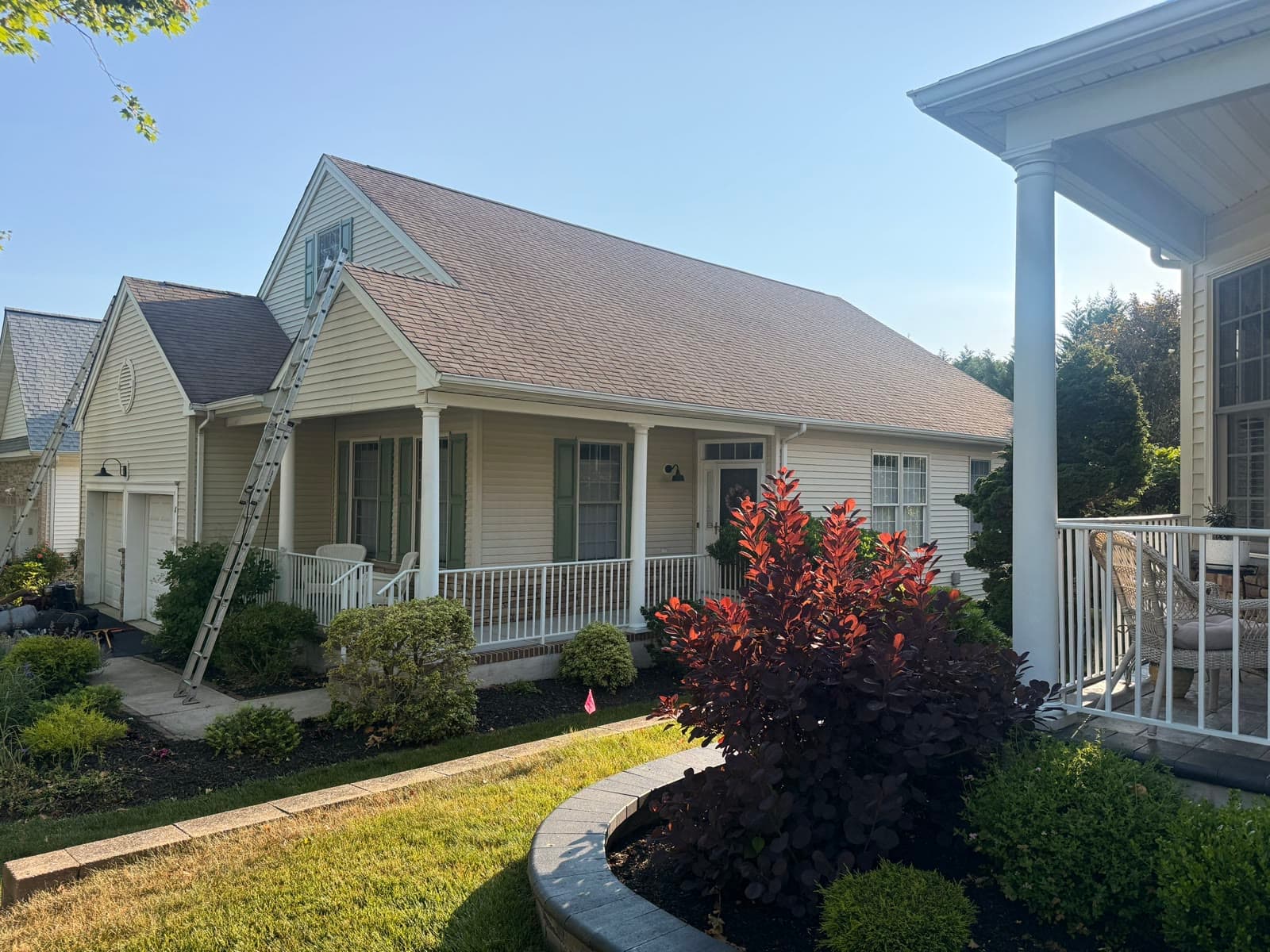 Cape-style home with a new roof and lush landscaping — Green Apple Roofing, New Jersey