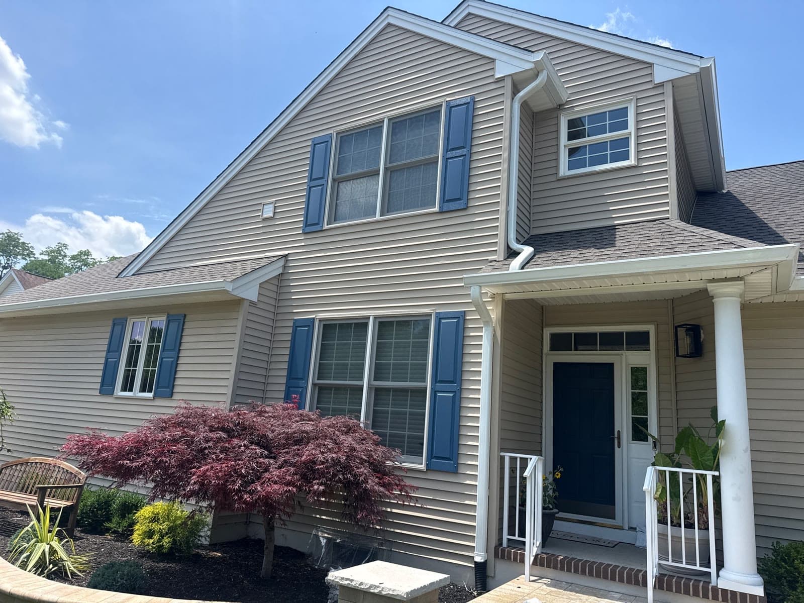 Two-story home with a blue door and new roof — Green Apple Roofing, New Jersey
