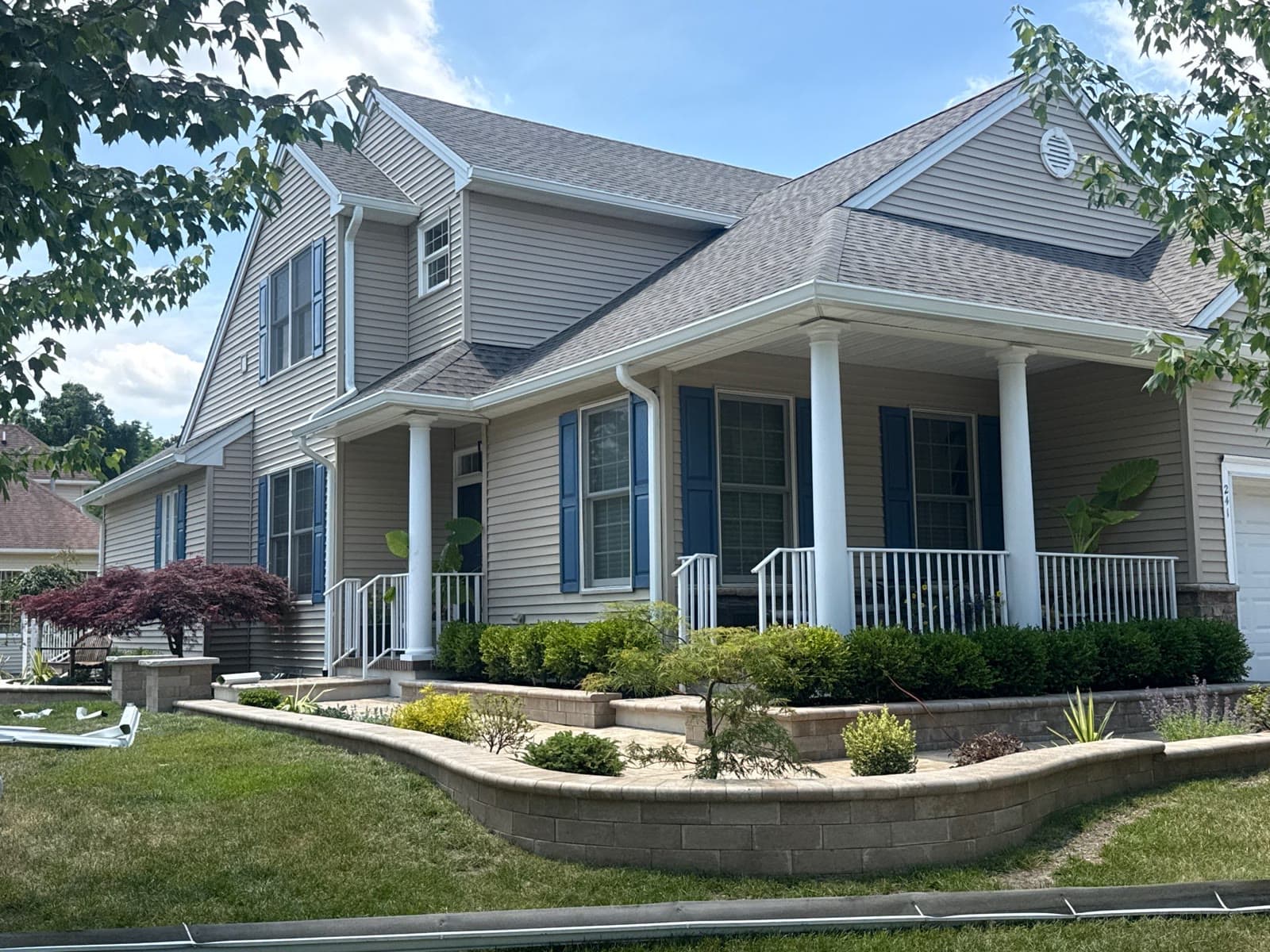 Two-story home with a porch and finished roof — Green Apple Roofing, New Jersey