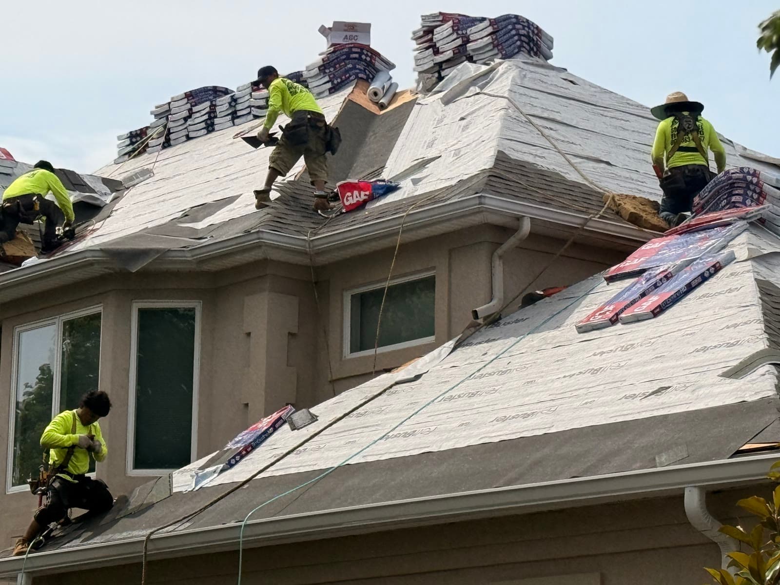 A Green Apple Roofing crew installing a new roof in New Jersey