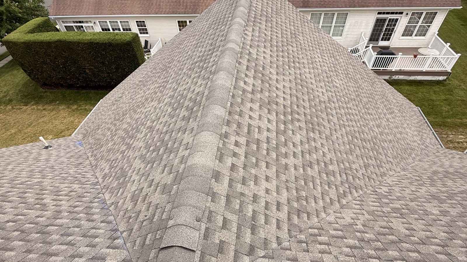 A freshly installed GAF Timberline architectural shingle roof on a New Jersey home, showing the dimensional shingle texture along the ridge